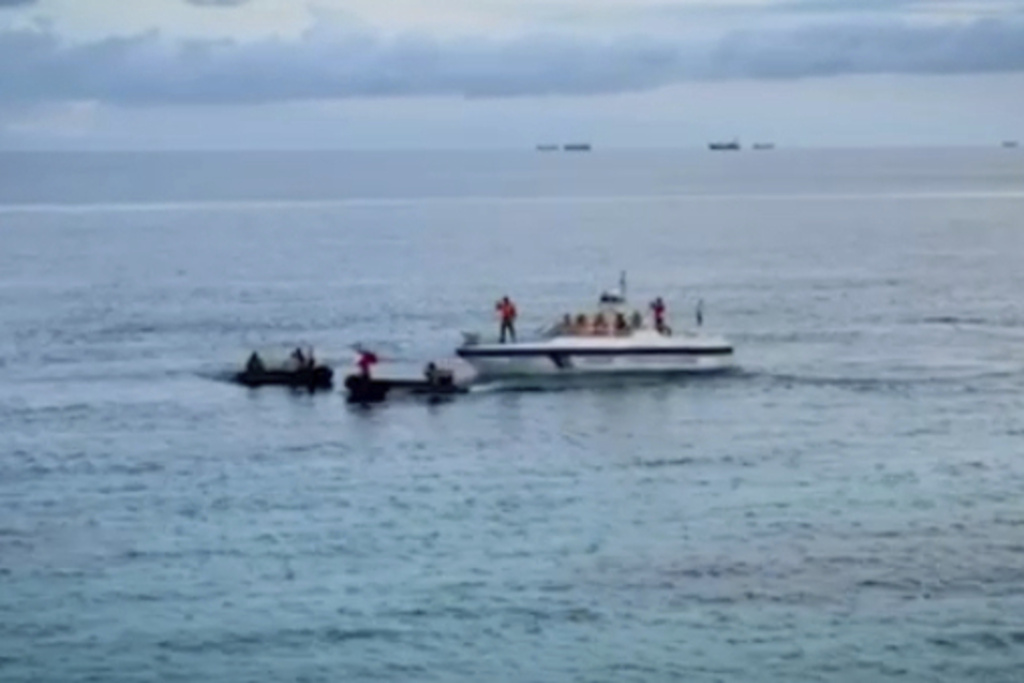In this photo taken from video provided by the Armed Forces of the Philippines, Public Information Office (PAO), two Philippine rubber boats block the attempt of a Chinese Coast Guard small boat to go near the long-grounded Philippine warship BRP Sierra Madre in the vicinity of Second Thomas Shoal at the disputed South China Sea on Wednesday August 20, 2025. (Armed Forces of the Philippines PAO via AP)