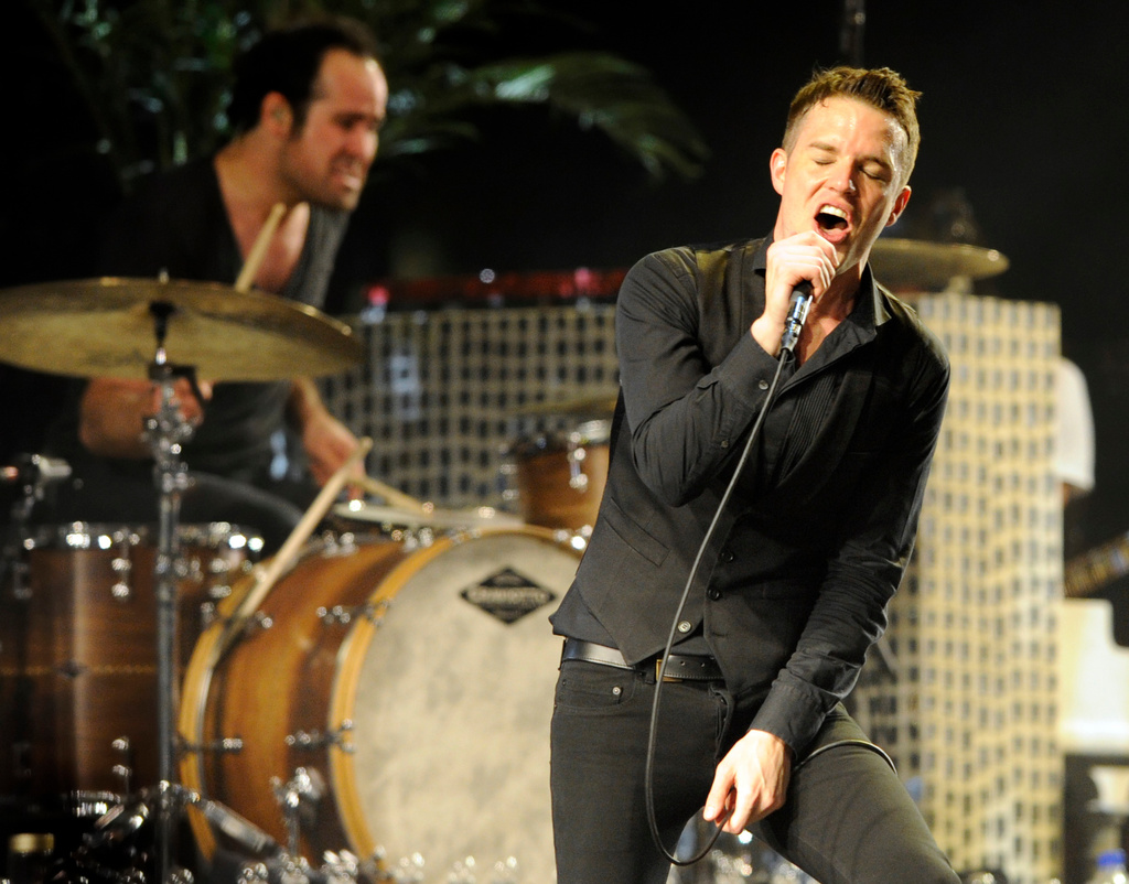 FILE - In this April 18, 2009 file photo, Brandon Flowers of The Killers performs during the band's headlining set on the second day of the Coachella Valley Music & Arts Festival in Indio, Calif. (AP Photo/Chris Pizzello, File)