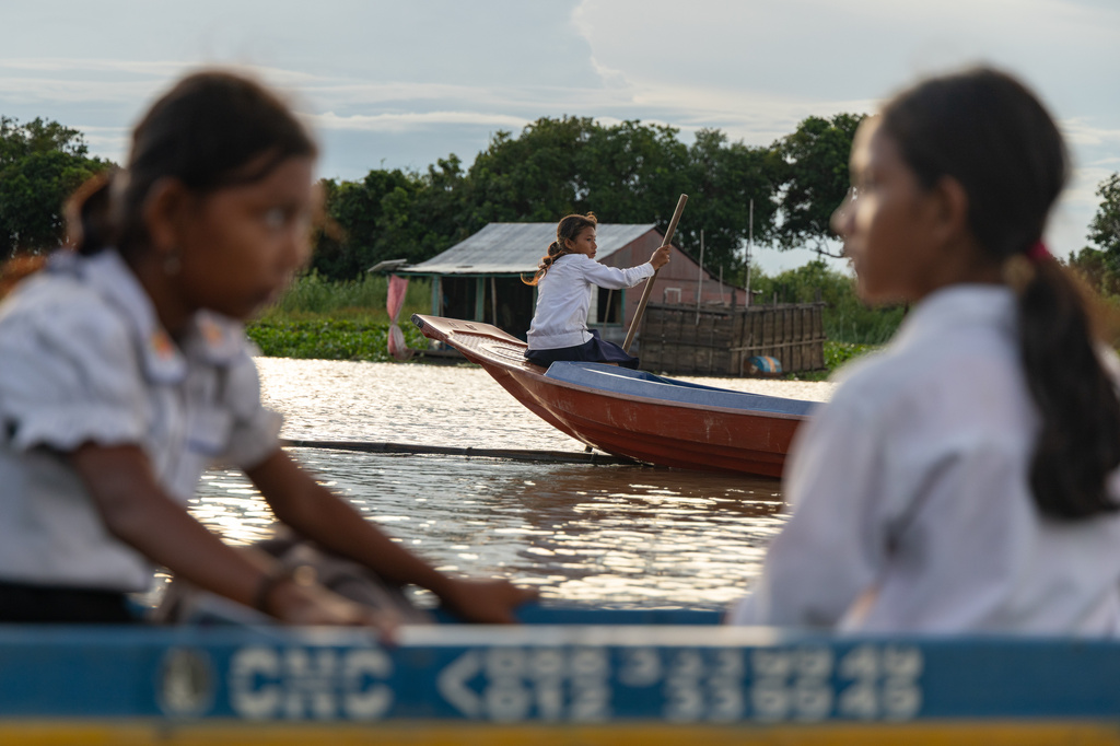 Students board school boats to return to their homes in a floating village on Cambodia's Tonle Sap Lake on Monday, June 29, 2026. (AP Photo/Anton L. Delgado)