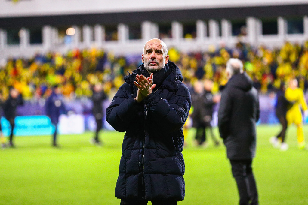Manchester City's coach Pep Guardiola applauds the crowd after the Champions League soccer match between Bodo/Glimt and Manchester City in Bodo, Norway, Tuesday, Jan. 20, 2026. (Fredrik Varfjell/NTB via AP)