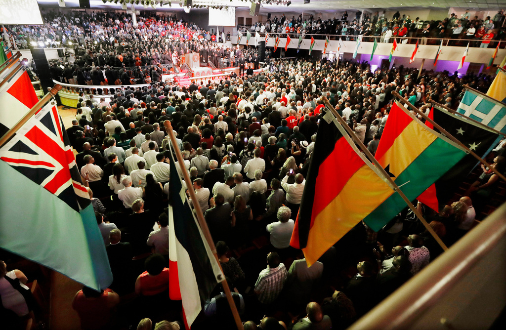 FILE - People attend a ceremony commemorating the final speech of Rev. Martin Luther King Jr. at the Mason Temple of the Church of God in Christ, Tuesday, April 3, 2018, in Memphis, Tenn. (AP Photo/Mark Humphrey, File)
