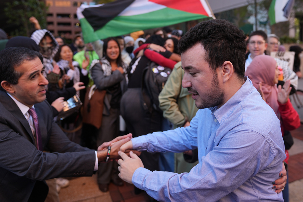 Palestinian activist Mahmoud Khalil meets with supporters outside Federal Court on Tuesday, Oct. 21, 2025 in Philadelphia (AP Photo/Matt Rourke)