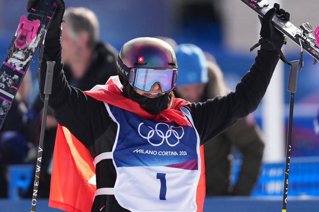 Switzerland's Mathilde Gremaud celebrates her gold medal win in the women's freestyle skiing slopestyle finals at the 2026 Winter Olympics, in Livigno, Italy, Monday, Feb. 9, 2026. (AP Photo/Lindsey Wasson)