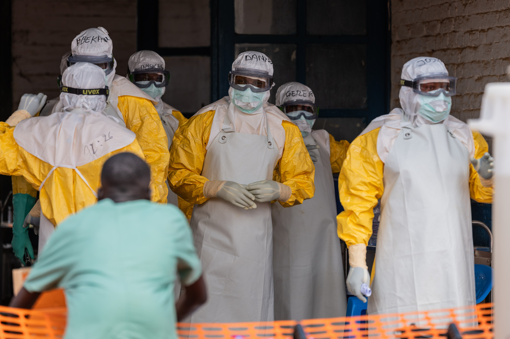 Health workers prepare for duty at the Mongbwalu treatment center in Mongbwalu, Congo, Friday, June 5, 2026. (AP Photo/Moses Sawasawa)