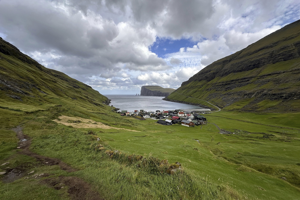 FILE - The view from a hiking trail of the village of Tjornuvik, Faroe Islands, Sept. 9, 2025. (AP Photo/Cara Anna, File)