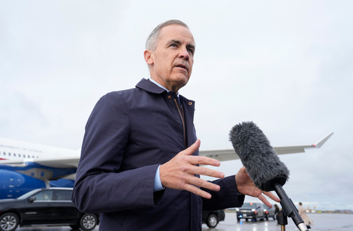 Canada Prime Minister Mark Carney speaks with members of the media before he boards a government plane in Ottawa on Friday Oct. 24, 2025. (Adrian Wyld/The Canadian Press via AP) Canada Prime Minister Mark Carney speaks with members of the media before he boards a government plane in Ottawa on Friday Oct. 24, 2025. (Adrian Wyld/The Canadian Press via AP)