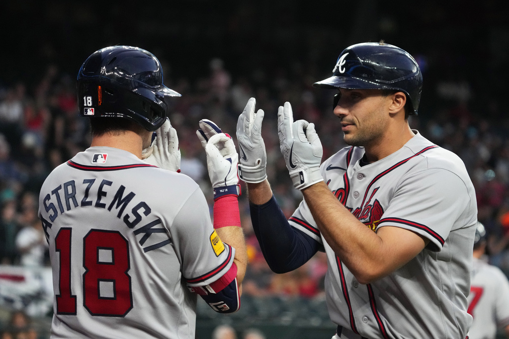 Atlanta Braves' Matt Olson celebrates with Mike Yastrzemski (18) after hitting a solo home run against the Arizona Diamondbacks in the first inning of a baseball game, Thursday, April 2, 2026, in Phoenix. (AP Photo/Rick Scuteri)