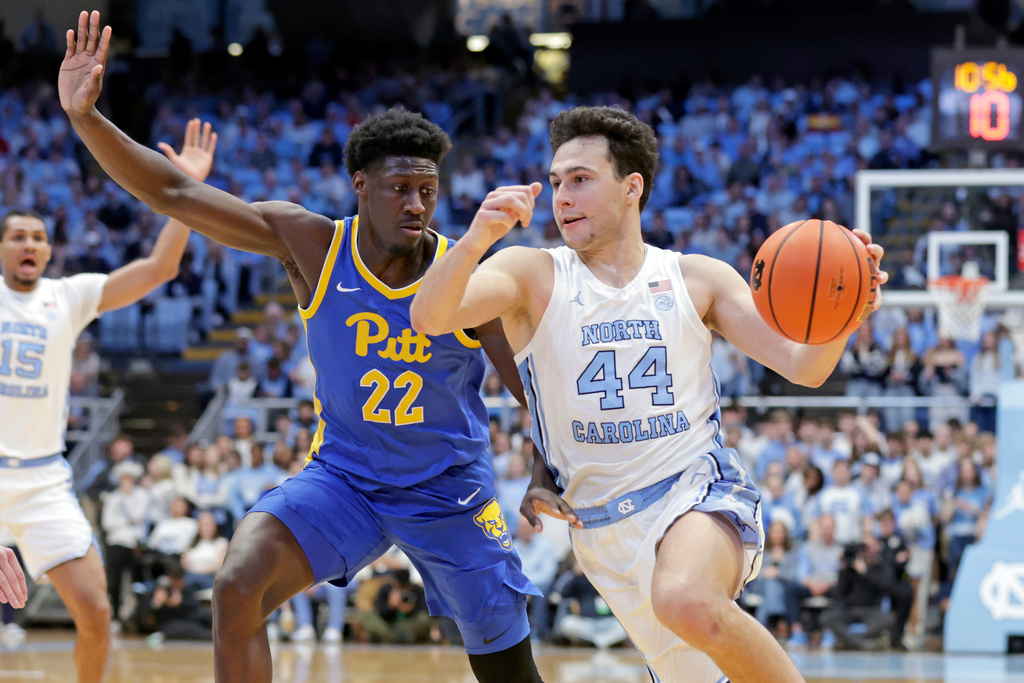 North Carolina guard Luka Bogavac (44) drives against Pittsburgh guard Barry Dunning Jr. (22) during the first half of an NCAA college basketball game Saturday, Feb. 14, 2026, in Chapel Hill, N.C. (AP Photo/Chris Seward)