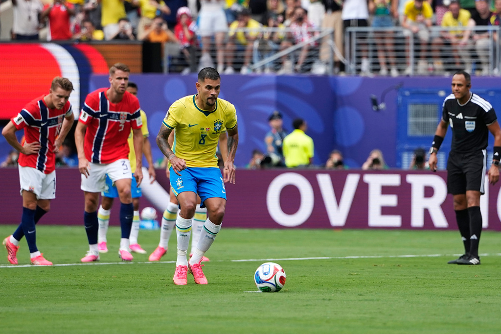 Brazil's Bruno Guimaraes (8) takes a penalty kick during the World Cup round of 16 soccer match between Brazil and Norway in East Rutherford, N.J., near New York, Sunday, July 5, 2026. (AP Photo/Frank Franklin II)