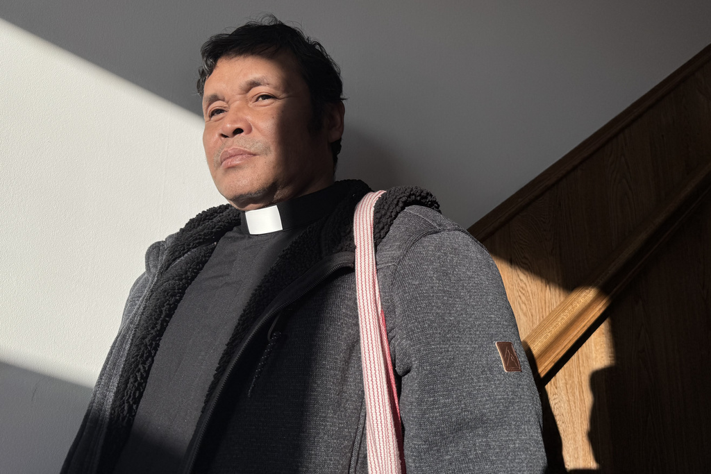 Saw Ba Mya James, an ethnic Karen refugee from Myanmar, stands for a portrait in St. Paul, Minn., on Jan. 28, 2026. (AP Photo/Jack Brook)