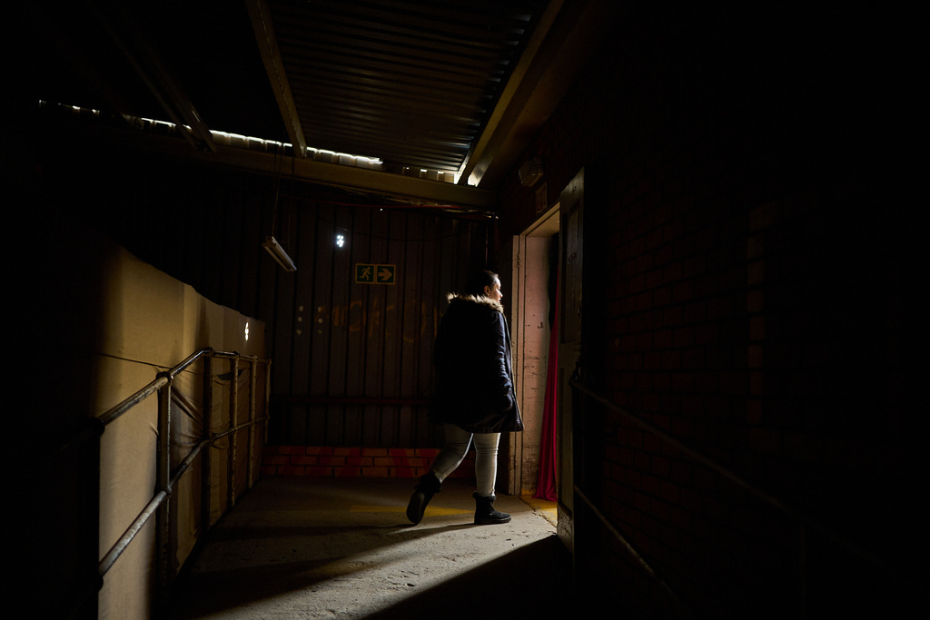 FILE - Rahila Omar, a compliance manager, walks through an empty hallway inside the Tzicc clothing factory following the threat of U.S.-imposed tariffs in Maseru, Lesotho, July 22, 2025. (AP Photo/Bram Janssen, File)