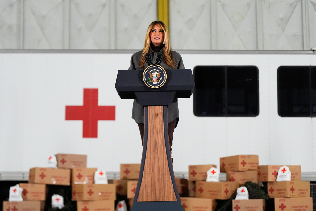 First lady Melania Trump speaks before building Red Cross holiday care packages and writing holiday cards to military service members, Monday, Dec. 1, 2025, at Joint Base Andrews, Md. (AP Photo/Julia Demaree Nikhinson)