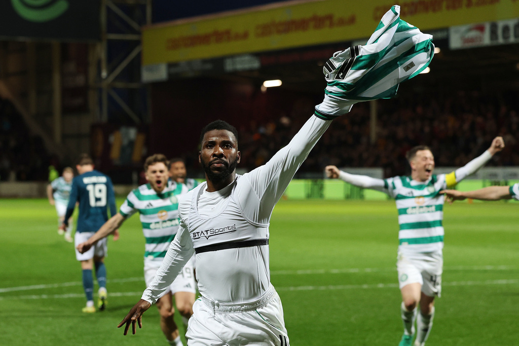 Celtic's Kelechi Iheanacho celebrates scoring their side's third goal from a penalty during the Scottish Premiership soccer match between Motherwell and Celtic, Wednesday, May 13, 2026, in Motherwell, Scotland. (Robert Perry/PA via AP)