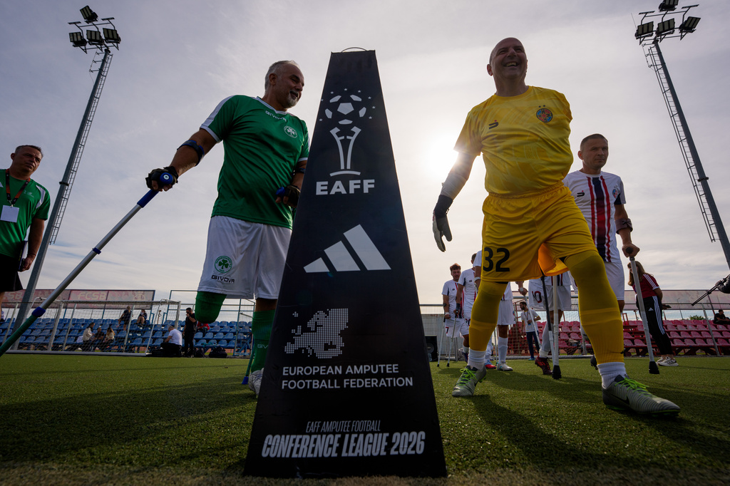 Players enter the pitch before an amputee soccer match between FCSB and Panathinaikos in the inaugural EAFF Conference League in Bucharest, Romania, Friday, Sept. 25, 2026. (AP Photo/Andreea Alexandru)