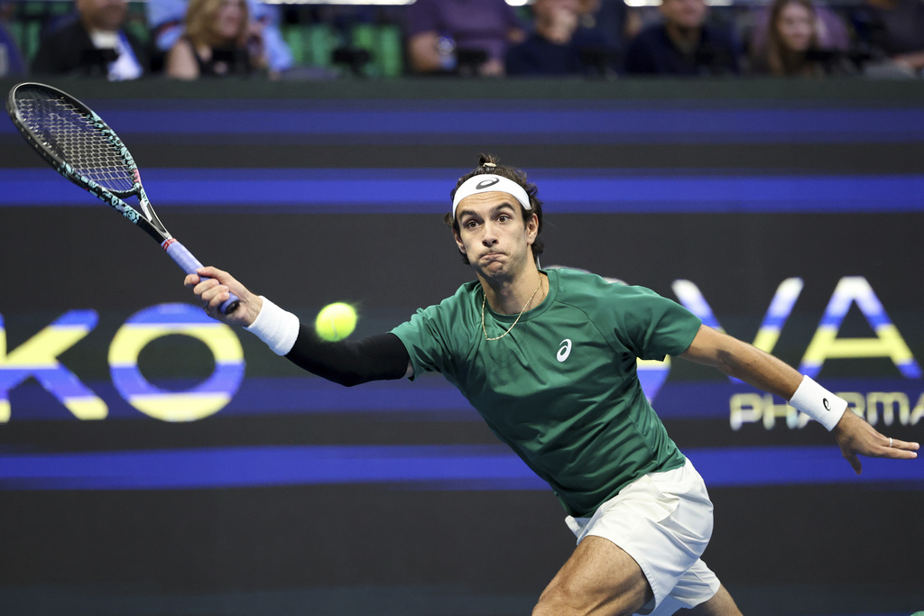 Lorenzo Musetti of Italy plays a shot against Novak Djokovic of Serbia during the ATP 250 tennis tournament final match, in Athens, Greece, Saturday, Nov. 8, 2025. (AP Photo/Yorgos Karahalis)