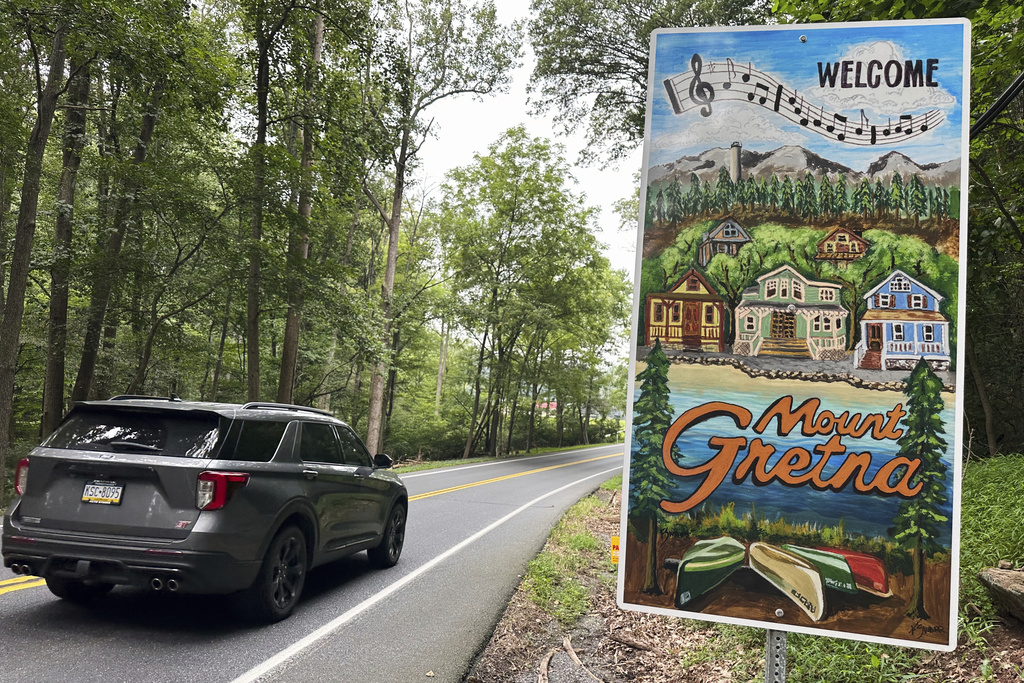 A sign on Pinch Road, shown Wednesday, Aug. 6, 2025, welcomes motorists to the town of Mount Gretna, Pa. (AP Photo/Mark Scolforo)
