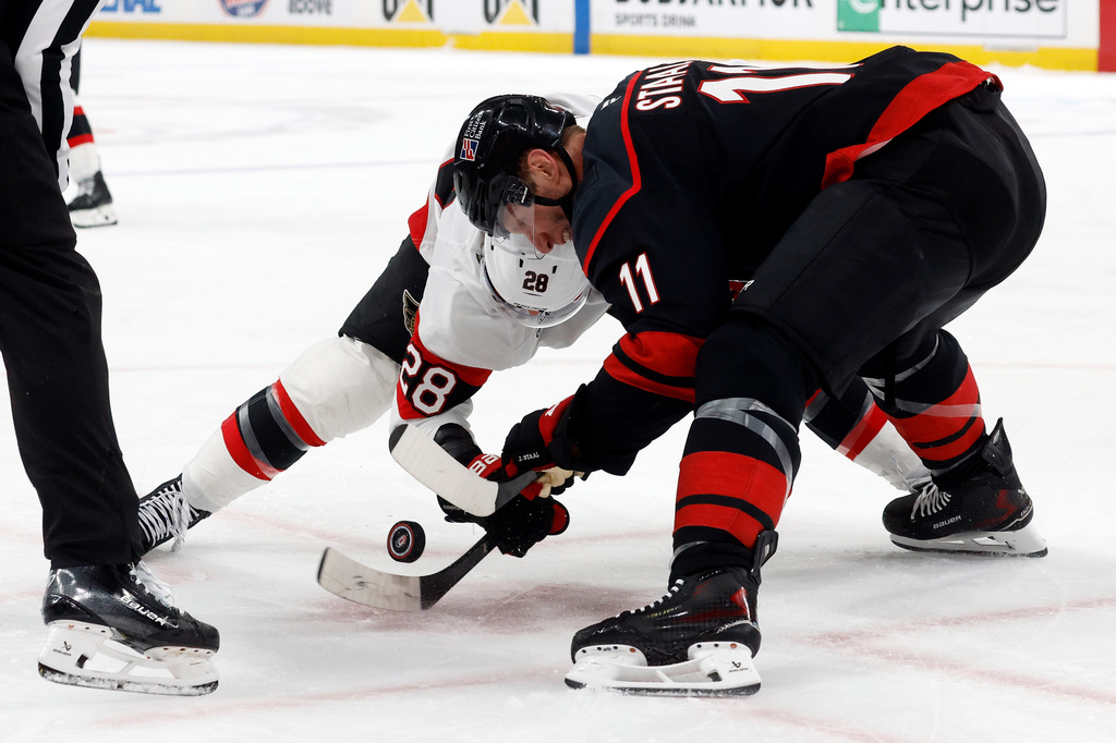 Carolina Hurricanes' Jordan Staal (11) wins a face-off against Ottawa Senators' Claude Giroux (28) during the first period of Game 2 of an NHL hockey Stanley Cup first-round playoff series in Raleigh, N.C., Monday, April 20, 2026. (AP Photo/Karl DeBlaker)
