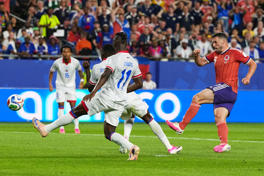 Scotland's John McGinn (7) scores his team's first goal during the World Cup Group C soccer match between Haiti and Scotland in Foxborough, Mass., near Boston, Saturday, June 13, 2026. (AP Photo/Martin Meissner)