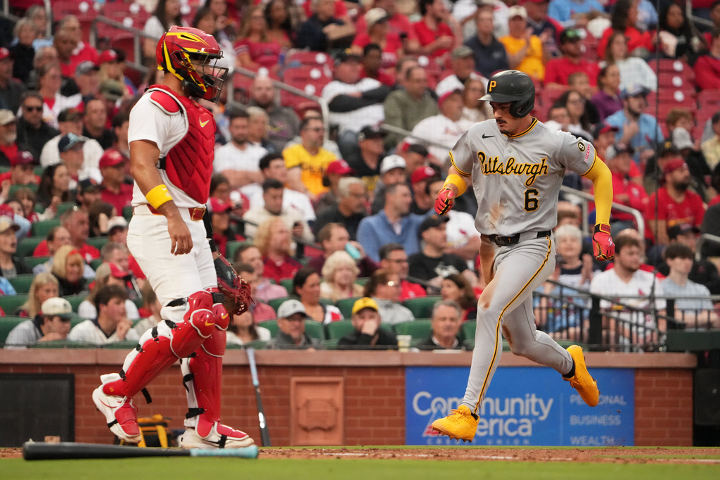 Pittsburgh Pirates' Konnor Griffin (6) scores past St. Louis Cardinals catcher Ivan Herrera during the fourth inning of a baseball game Wednesday, May 20, 2026, in St. Louis. (AP Photo/Jeff Roberson)