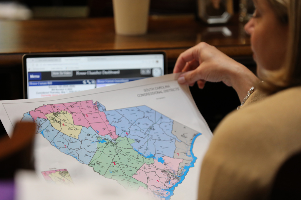 Republican South Carolina Rep. Jackie Terribile looks at a proposed map of new U.S. House districts for South Carolina on Thursday, May 7, 2026, in Columbia, S.C. (AP Photo/Jeffrey Collins)