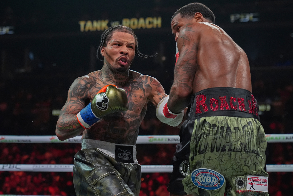 FILE - Gervonta Davis, left, punches Lamont Roach during the third round of a WBA lightweight championship boxing bout Saturday, March 1, 2025, in New York. (AP Photo/Frank Franklin II, File)