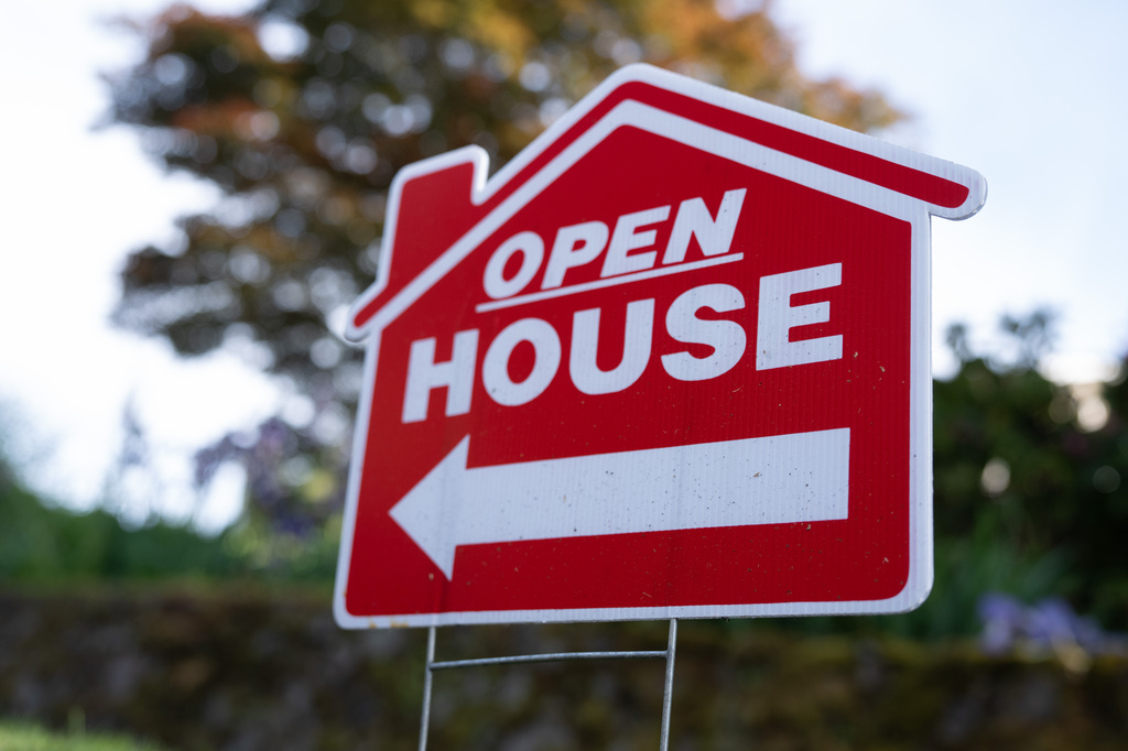 A sign is displayed outside a home for sale on Tuesday, May 12, 2026, in Portland, Ore. (AP Photo/Jenny Kane)