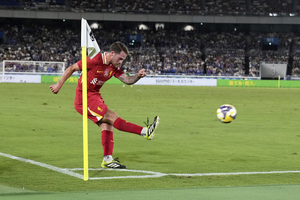 Liverpool's Alexis Mac Allister takes a corner kick during a friendly soccer match between Yokohama F. Marinos and Liverpool F.C. at Nissan Stadium in Yokohama, Japan, Wednesday, July 30, 2025. (AP Photo/Eugene Hoshiko)