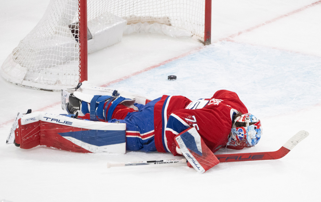 Montreal Canadiens goaltender Jakub Dobes (75) reacts following a goal by Florida Panthers' Cole Reinhardt (not shown) during second period NHL hockey action in Montreal on Tuesday, April 7, 2026. (Christinne Muschi/The Canadian Press via AP)