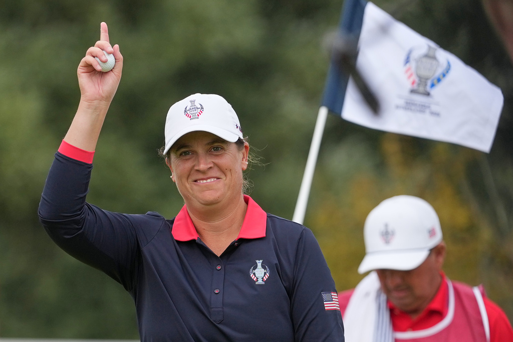 Lauren Coughlin of the United States reacts after holing a putt on the 5th green during the Solheim Cup in Den Bosch, Netherlands, Saturday, Sept. 12, 2026. (AP Photo/Alastair Grant)