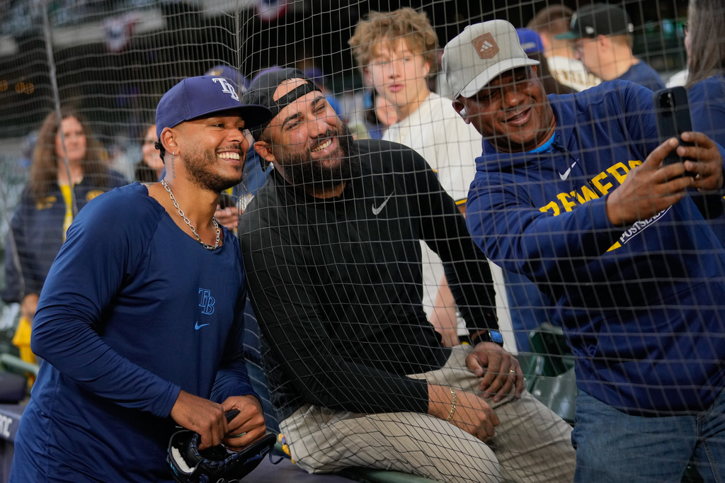 Tampa Bay Rays pitcher Freddy Peralta takes a photo with fans prior to Game 2 of baseball's World Series, Saturday, Oct. 24, 2026, in Milwaukee, between the Milwaukee Brewers and the Tampa Bay Rays. (AP Photo/Kayla Wolf)