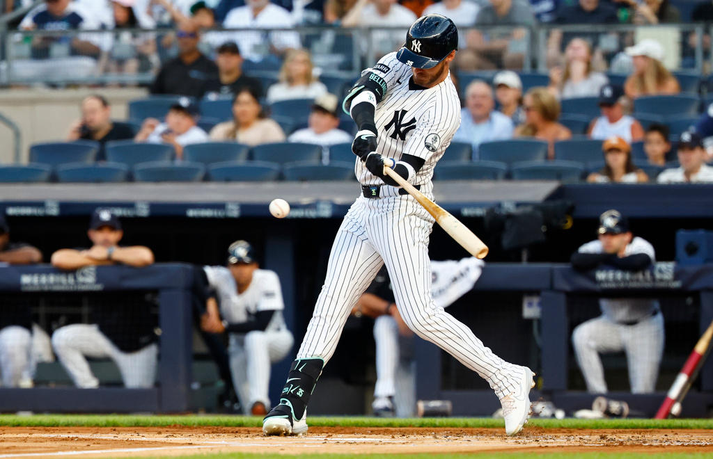 New York Yankees' Cody Bellinger hits an RBI single against the Los Angeles Dodgers during the first inning of the second game of a baseball double header, Sunday, July 19, 2026 in New York. (AP Photo/Noah K. Murray)