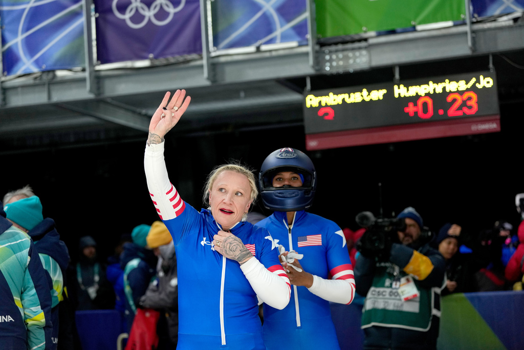 United States' Kaillie Armbruster Humphries, left, and Jasmine Jones, right, arrive at the finish during a two women bobsled run at the 2026 Winter Olympics, in Cortina d'Ampezzo, Italy, Friday, Feb. 20, 2026. (AP Photo/Alessandra Tarantino)