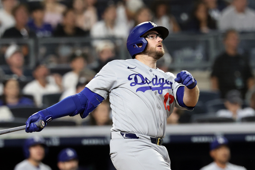 Los Angeles Dodgers' Max Muncy watches his two-run home run during the seventh inning of a baseball game against the New York Yankees, Friday, July 17, 2026, in New York. (AP Photo/Adam Hunger)