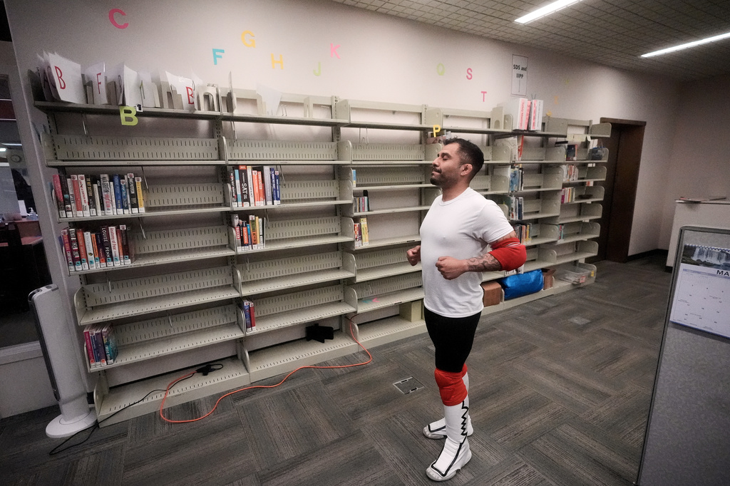 Wrestler Rufio Banderas warms up before a match during a Lucha Libro pro wrestling event at Benicia Public Library Saturday, May 2, 2026, in Benicia, Calif. (AP Photo/Jeff Chiu)