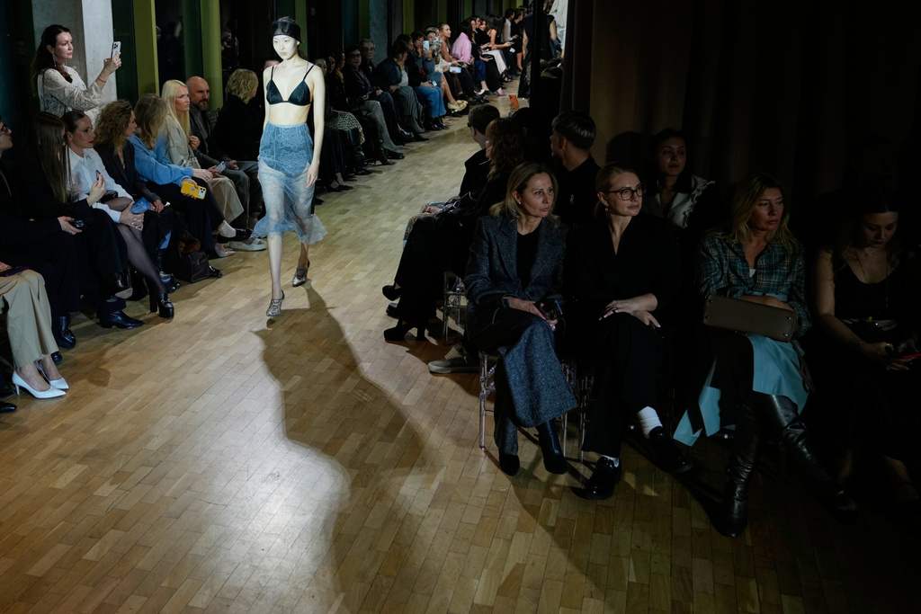A model wears a creation by Russian brand Ruban on a runway at the Moscow Fashion Week in Moscow, Tuesday, March 17, 2026. (AP Photo/Pavel Bednyakov)
