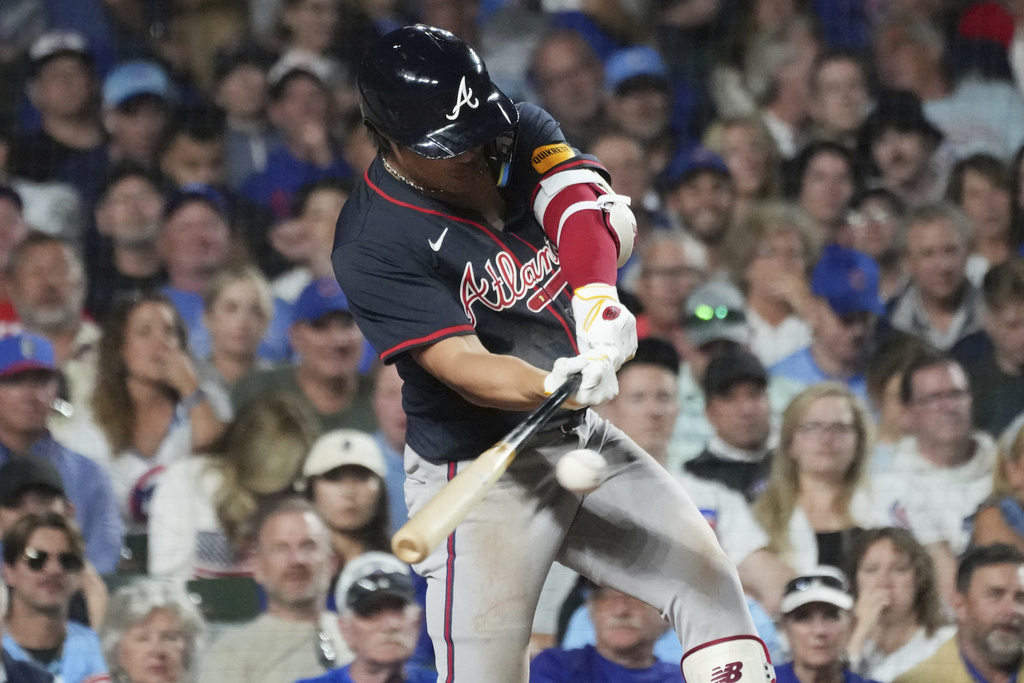Atlanta Braves' Ha-Seong Kim, of South Korea, hits a single during the seventh inning of a baseball game against the Chicago Cubs in Chicago, Tuesday, Sept. 2, 2025. (AP Photo/Nam Y. Huh)