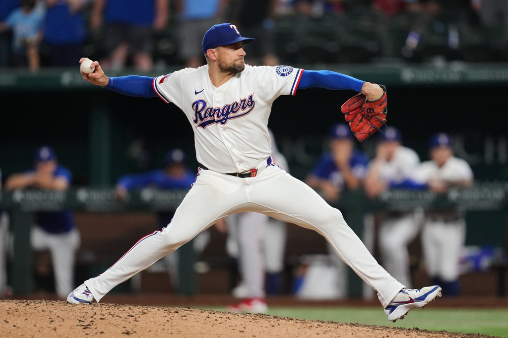 Texas Rangers pitcher Nathan Eovaldi throws to the Boston Red Sox in the ninth inning of a baseball game Wednesday, Sept. 16, 2026, in Arlington, Texas. (AP Photo/Tony Gutierrez)