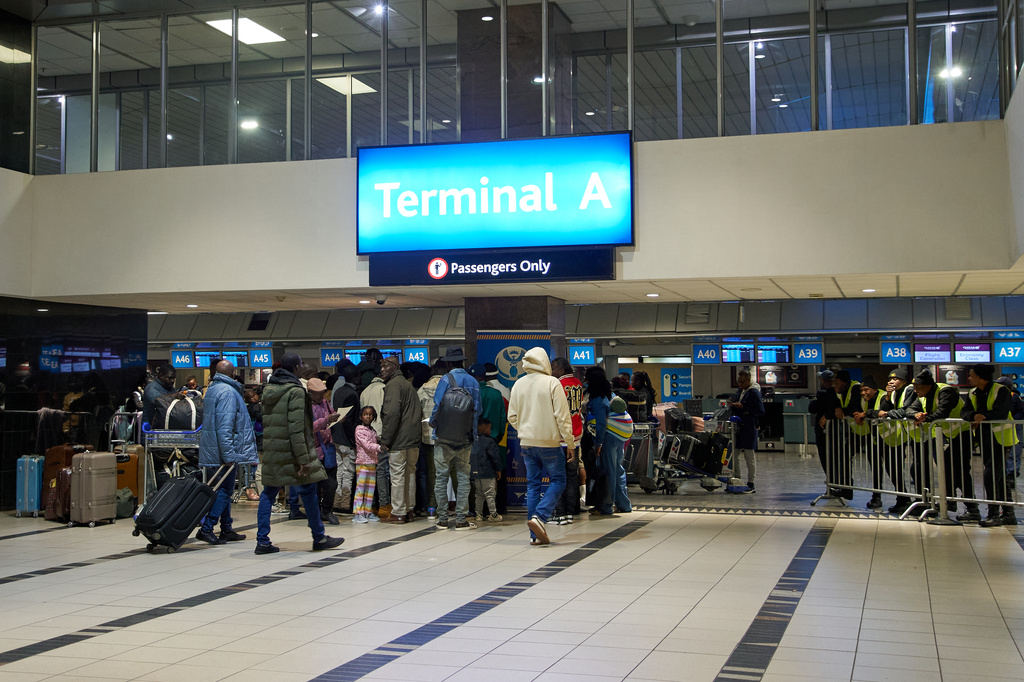 Ghanaian nationals arrive at O.R. Tambo International Airport ahead of a repatriation flight to Ghana, in Johannesburg, South Africa, Wednesday, May 27, 2026. (AP Photo/Kayleen Morgan)