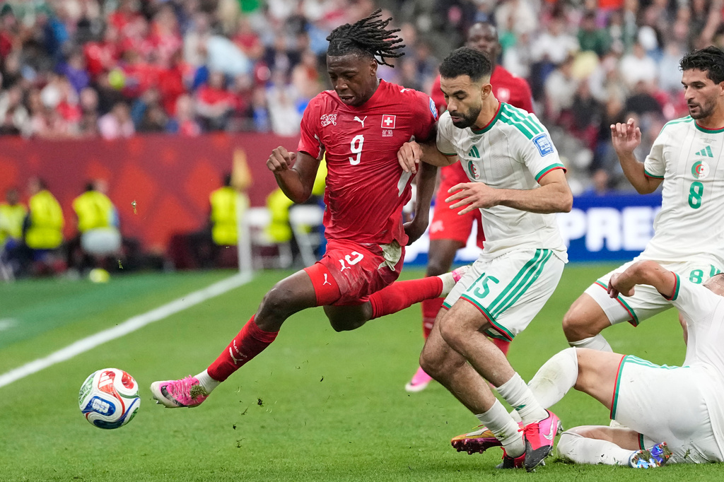 Switzerland's Johan Manzambi (9) and Algeria's Rayan Ait-Nouri (15) battle for the ball during the World Cup round of 32 soccer match between Switzerland and Algeria in Vancouver, British Columbia, Thursday, July 2, 2026. (AP Photo/Lindsey Wasson)