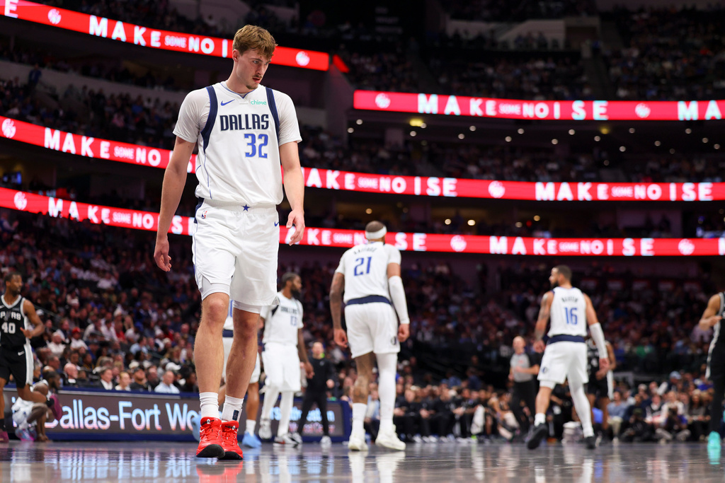 Dallas Mavericks forward Cooper Flagg (32) prepares to defend in the second half of an NBA basketball game against the San Antonio Spurs Thursday, Feb. 5, 2026, in Dallas. (AP Photo/Gareth Patterson)