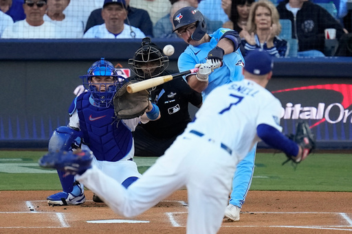 Toronto Blue Jays' Davis Schneider connects for a solo home run off Los Angeles Dodgers pitcher Blake Snell (7) leave the park during the first inning in Game 5 of baseball's World Series, Wednesday, Oct. 29, 2025, in Los Angeles. (AP Photo/David J. Phillip) Toronto Blue Jays' Davis Schneider connects for a solo home run off Los Angeles Dodgers pitcher Blake Snell (7) leave the park during the first inning in Game 5 of baseball's World Series, Wednesday, Oct. 29, 2025, in Los Angeles. (AP Photo/David J. Phillip)