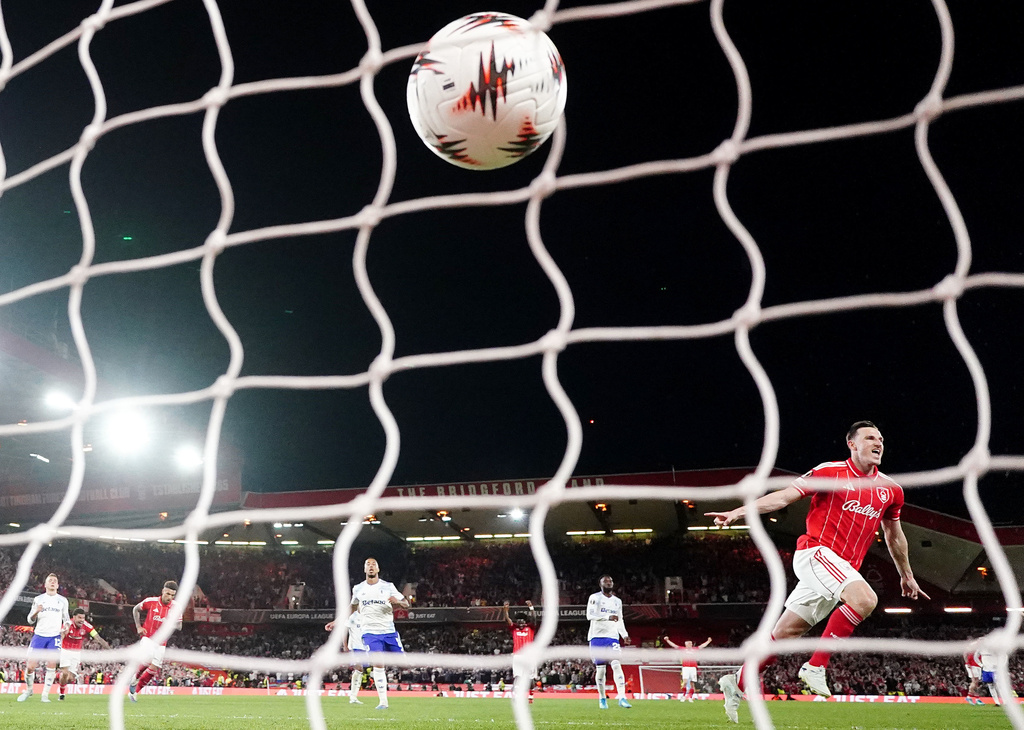 Nottingham Forest's Chris Wood celebrates scoring their side's first goal from a penalty kick during the Europa League semifinal first leg soccer match between Nottingham Forest and Aston Villa in Nottingham, England, Thursday, April 30, 2026. (David Davies/PA via AP)