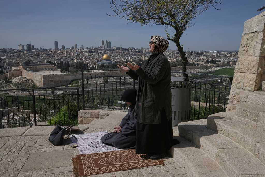 Palestinian women offer Friday Ramadan prayers in Jerusalem, as the Old City remains closed to visitors under nationwide Home Front Command restrictions banning large gatherings amid the war with Iran, Friday, March 6, 2026. (AP Photo/Mahmoud Illean)