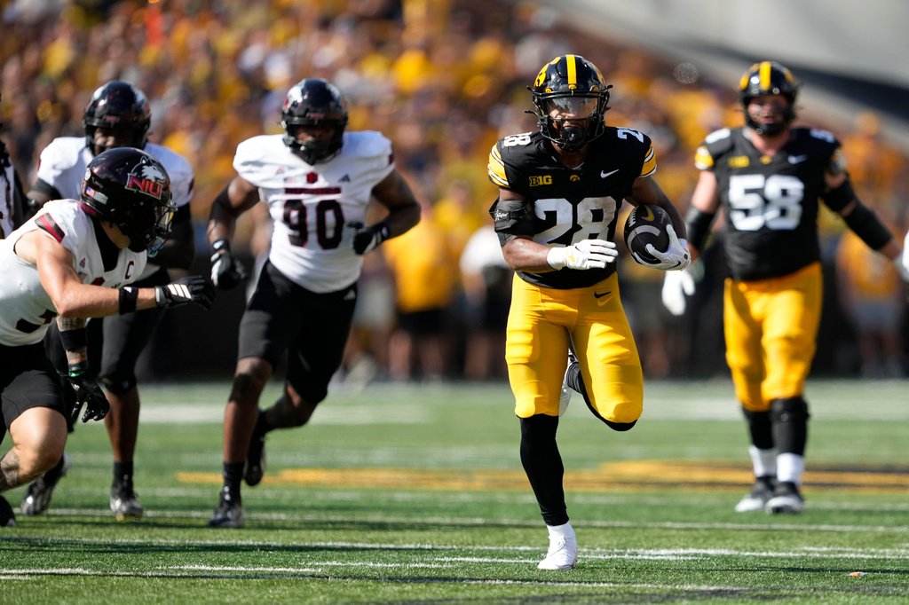 Iowa running back Kamari Moulton (28) runs for a touchdown during the first half of an NCAA college football game against Northern Illinois, Saturday, Sept. 5, 2026, in Iowa City, Iowa. (AP Photo/Charlie Neibergall)