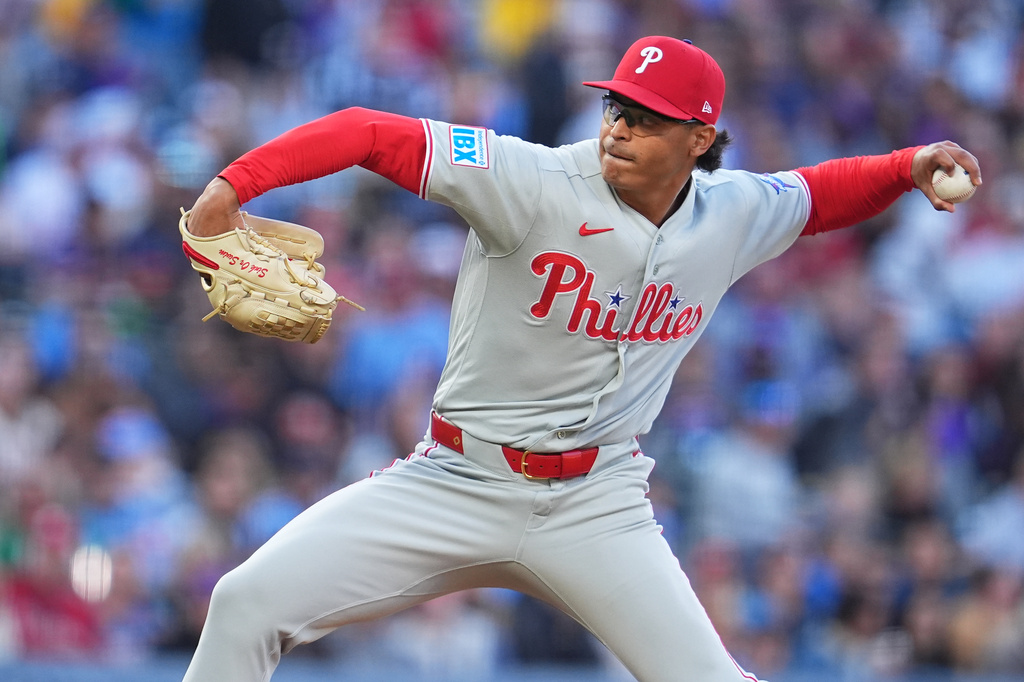 Philadelphia Phillies relief pitcher Jesús Luzardo works against the Colorado Rockies in the first inning of a baseball game Saturday, April 4, 2026, in Denver. (AP Photo/David Zalubowski)