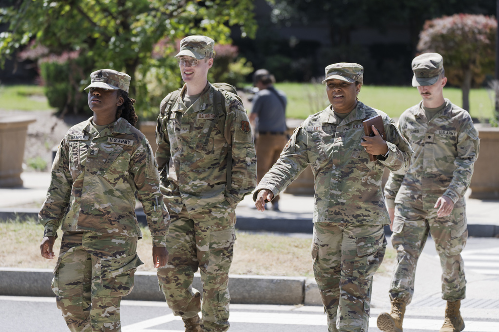 Troops depart the District of Columbia National Guard Headquarters as President Donald Trump implements his order to use federal law enforcement and the National Guard to expel homeless people and rid the nation's capital of violent crime, in Washington, Tuesday, Aug. 12, 2025. (AP Photo/J. Scott Applewhite)
