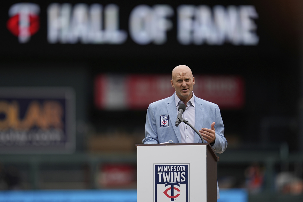 Former Minnesota Twins player Corey Koskie speaks during a ceremony after being inducted into the team's Hall of Fame before a baseball game against the Detroit Tigers, Sunday, Aug. 17, 2025, in Minneapolis. (AP Photo/Abbie Parr)