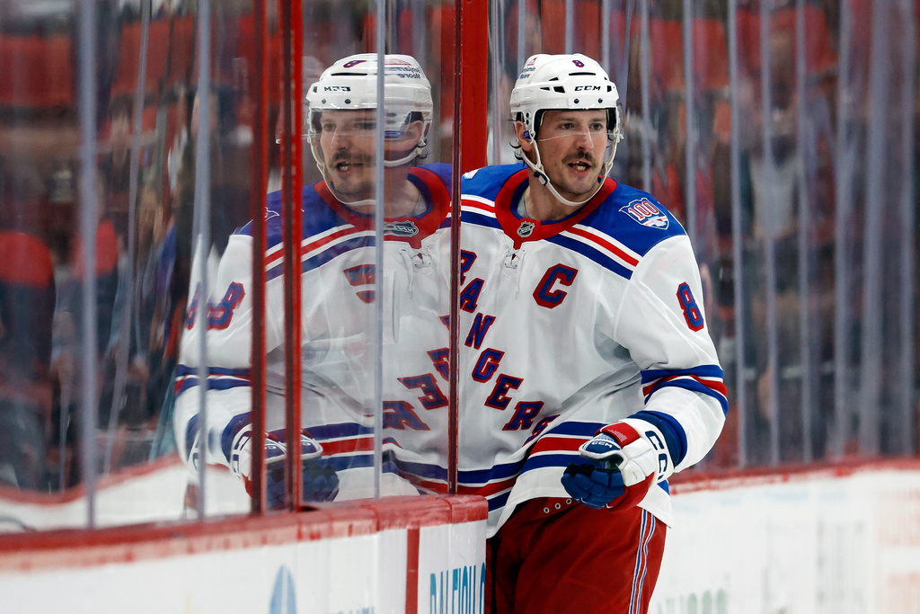 New York Rangers' J.T. Miller (8) protests a penalty lateen the third period of an NHL hockey game against the Carolina Hurricanes in Raleigh, N.C., Wednesday, Nov. 26, 2025. (AP Photo/Karl DeBlaker)