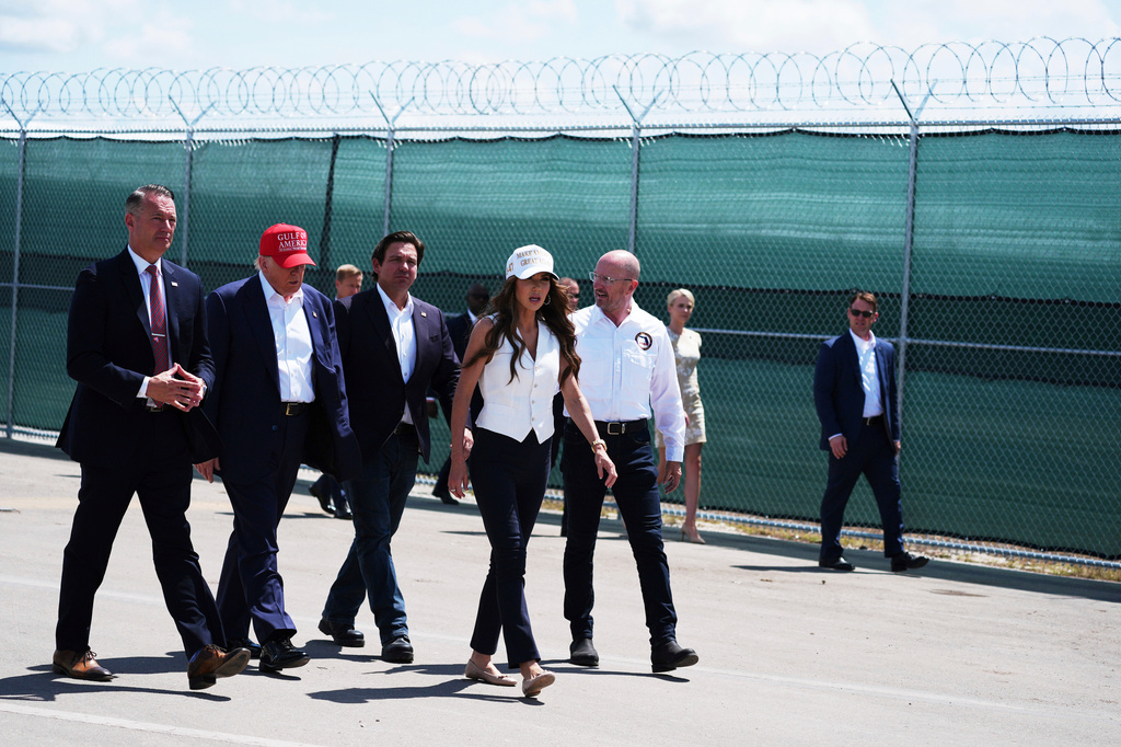 FILE - President Donald Trump, Gov. Ron DeSantis, R-Fla., and Homeland Security Secretary Kristi Noem and others tour "Alligator Alcatraz," a new migrant detention facility at Dade-Collier Training and Transition facility, July 1, 2025, in Ochopee, Fla. (AP Photo/Evan Vucci, File)