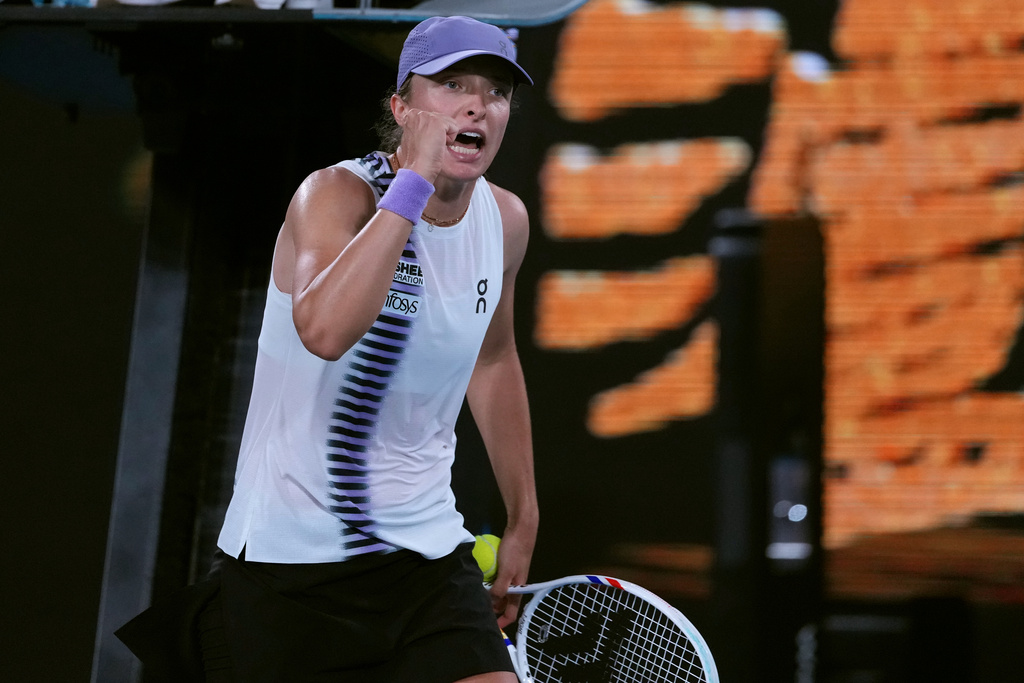 Iga Swiatek of Poland reacts after defeating Anna Kalinskaya of Russia in their third round match at the Australian Open tennis championship in Melbourne, Australia, Saturday, Jan. 24, 2026. (AP Photo/Aaron Favila)
